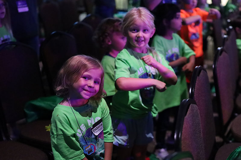 Volunteers leading a game at Vacation Bible School