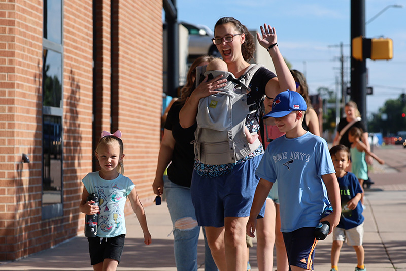 Friends laughing during an outdoor VBS activity