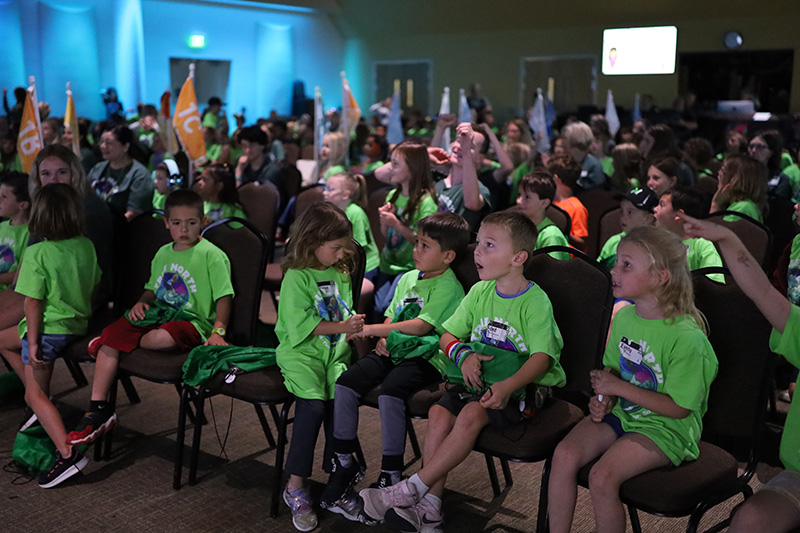 Group of children worshiping at Vacation Bible School