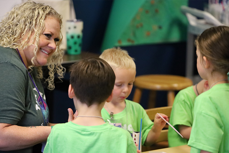 Children talking with a leader during small group time