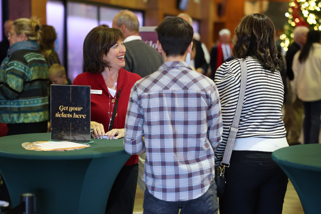 Greeters welcoming families at the door